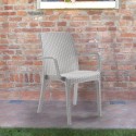 Stock 18 stackable rattan chairs with armrests outdoor garden Indiana BICA Price