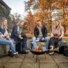 Round Cast Iron Outdoor Fire Pit with Black Finish on Tripod On Sale